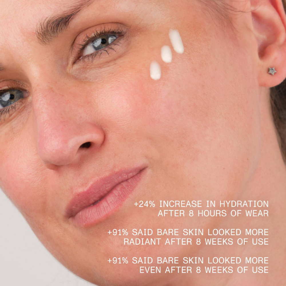 Close-up of a woman's face with skincare product application, showing hydration benefits.
