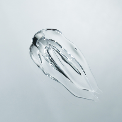 Clear gel-like substance on a light gray background