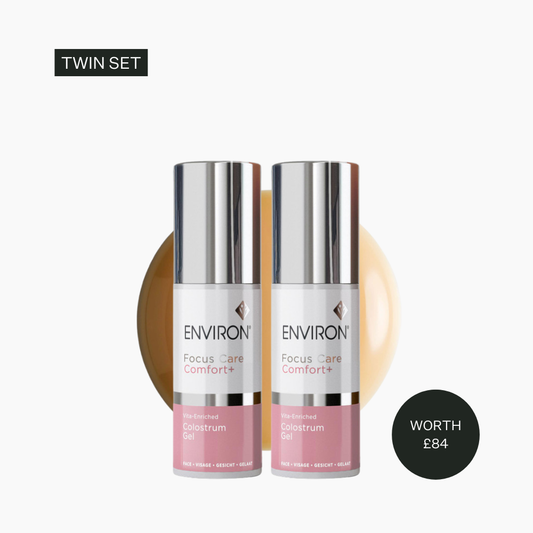 Two skincare bottles labeled 'Environ' on a white background