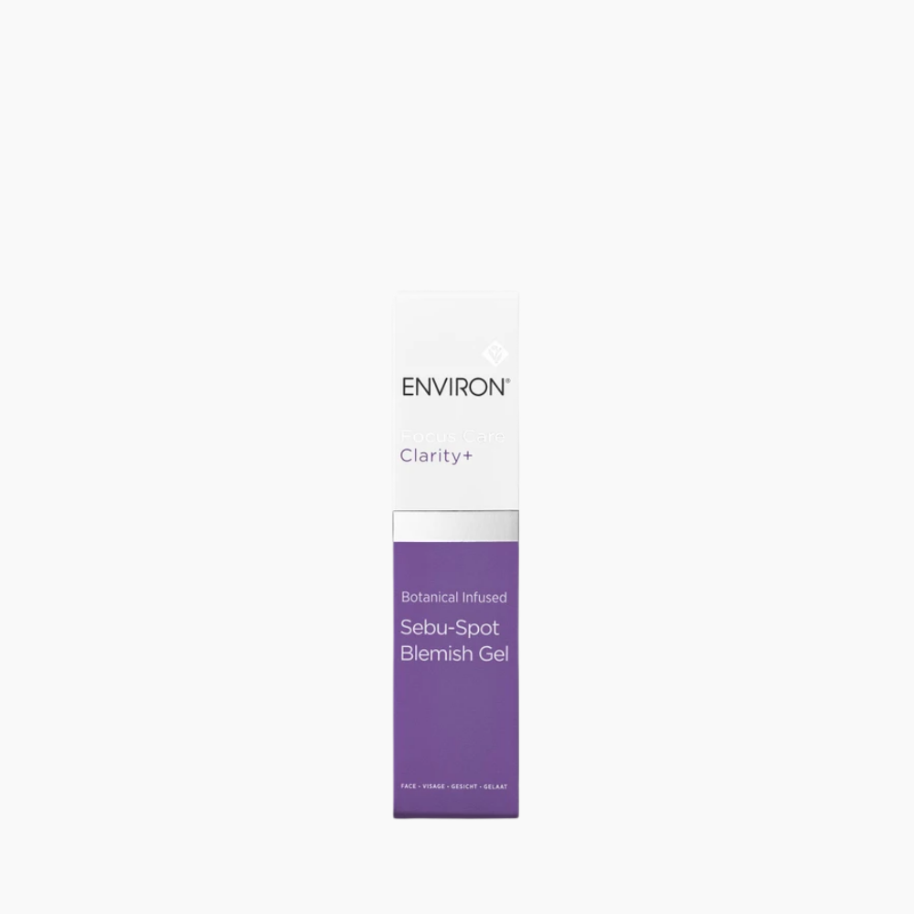 A tall, narrow white and purple box of Environ Clarity+ Sebu-Spot Blemish Gel, centered on a plain white background.