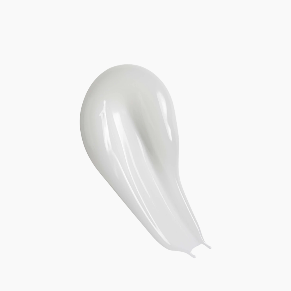 A glossy, smooth smear of white cream or gel on a plain white background.
