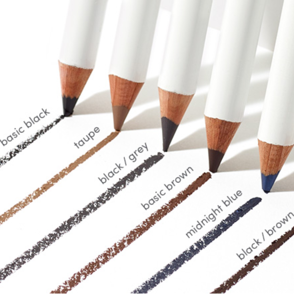 Six cosmetic pencils with white barrels and wooden tips arranged diagonally on a white background, each showing a different color swatch labeled basic black, taupe, black/gray, basic brown, midnight blue, and black/brown.