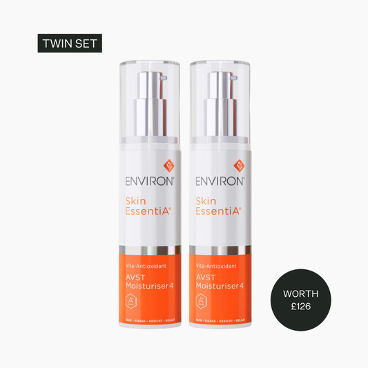 Two skincare bottles labeled 'Environ Skin Essentia' on a white background