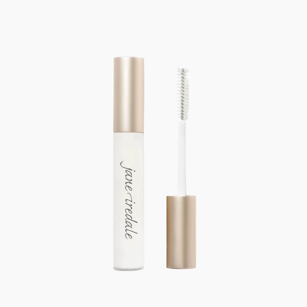 A clear cosmetic tube with a metallic champagne-gold cap, shown next to its applicator wand on a clean white background. The brand name 'jane reddle' is printed in black script on the tube.
