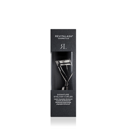 Revitalash Cosmetics Signature Eyelash Curler in its black packaging box, shown against a plain white background.