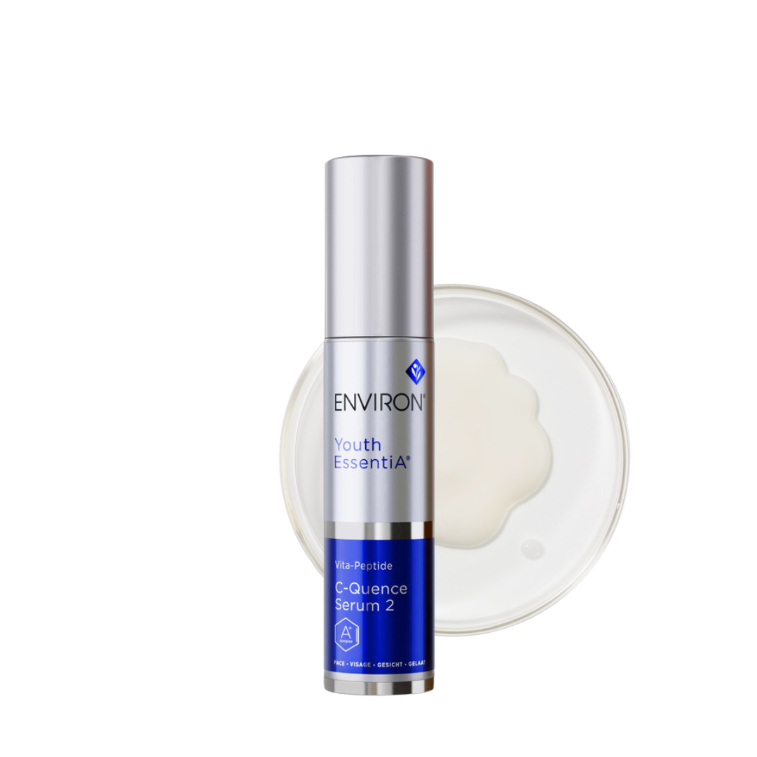 Environ Youth EssentiA C-Quence Serum 2 in a sleek blue and white 35ml bottle. The packaging prominently displays the Environ logo and product name. This advanced serum contains high levels of vitamins A, C, and E, along with antioxidants and peptides to combat ageing signs, improve skin tone, and enhance firmness. Ideal for mature, photo-damaged skin, it supports collagen production and reduces wrinkles. The bottle includes a convenient pump dispenser for precise application.