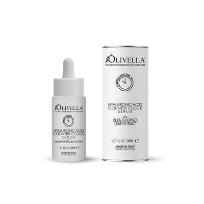 Olivella Counter Clock Hyaluronic Acid Face Serum packaging and bottle. The packaging is white with product information, and the bottle is clear with a dropper.